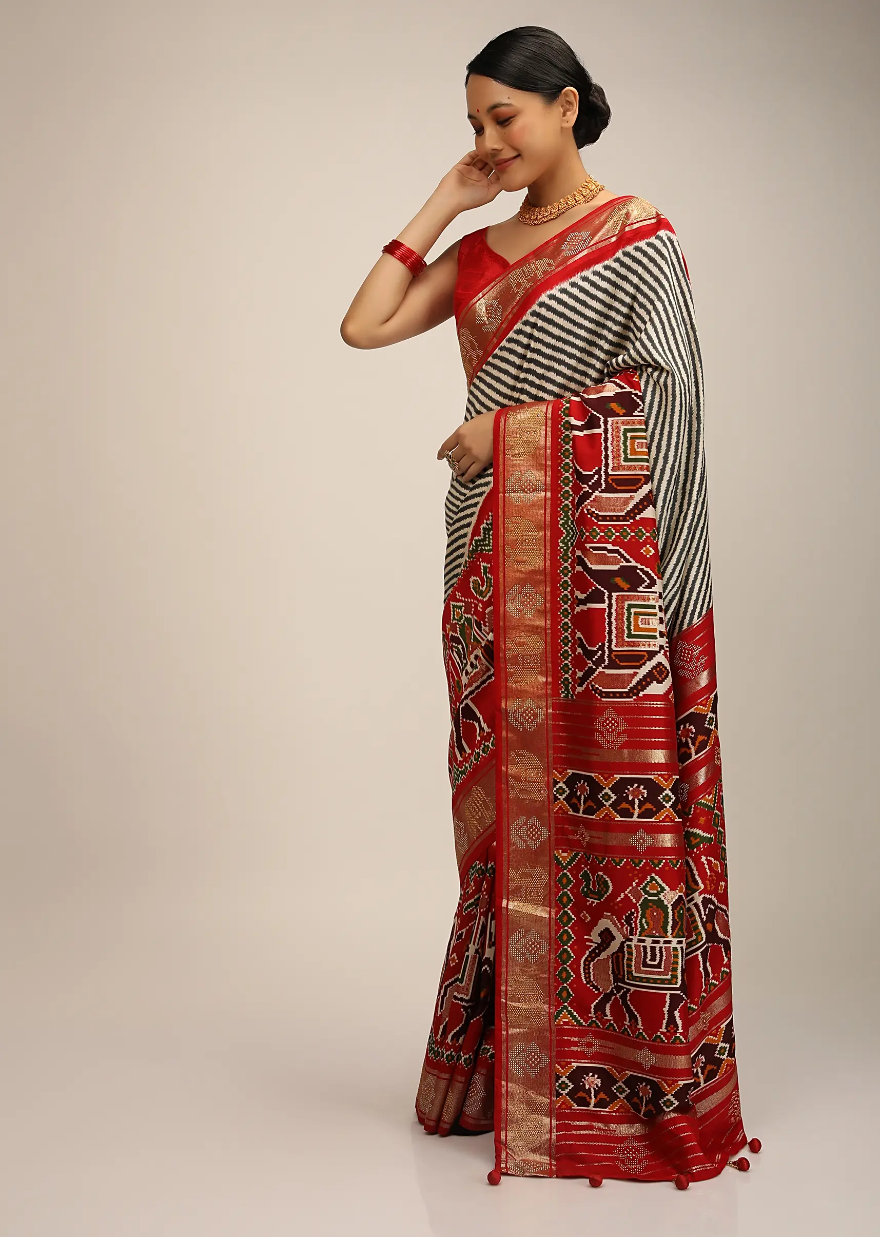 Red Saree In Silk With Multi Colored Patola Print And Diagonal Stripes