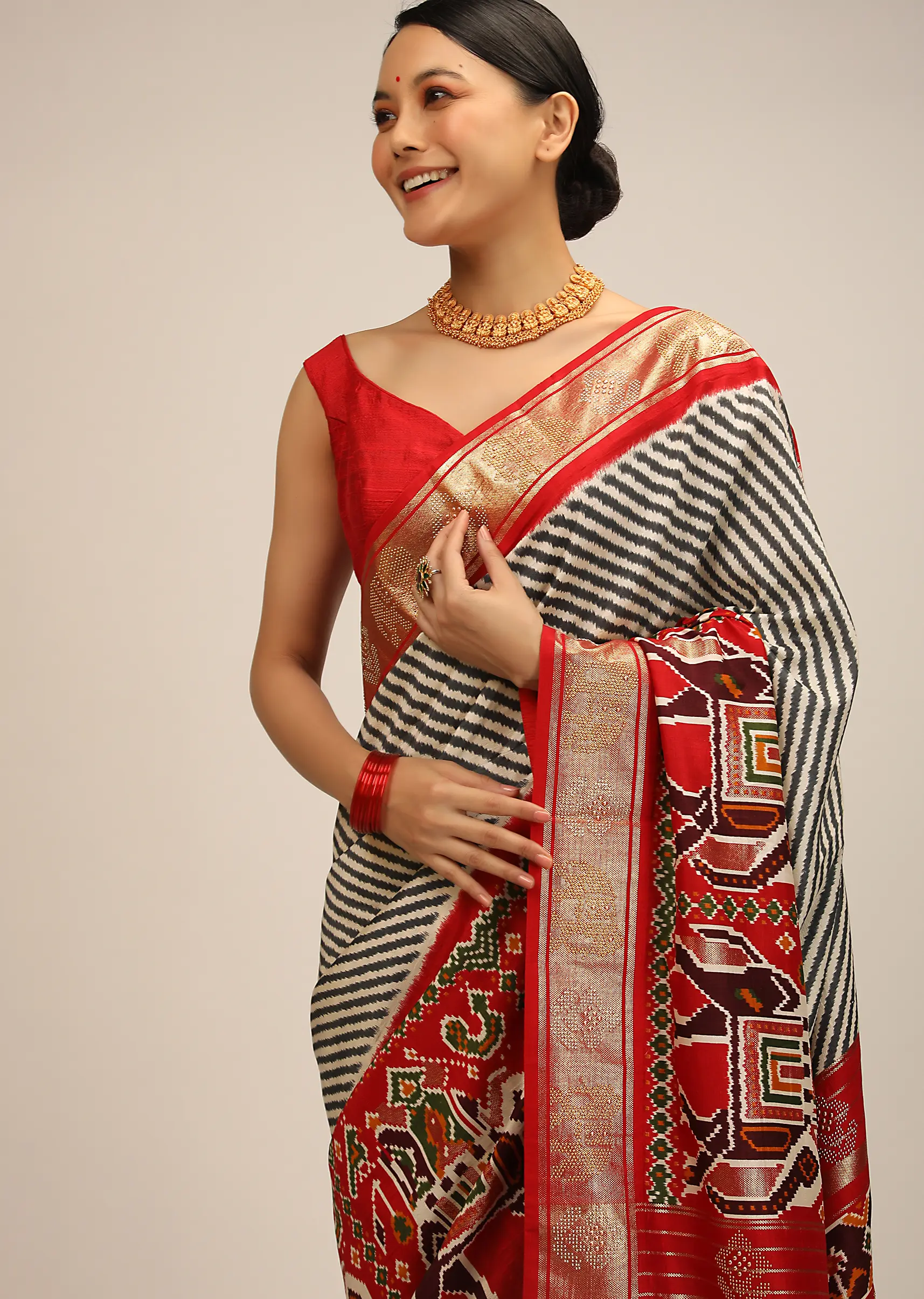 Red Saree In Silk With Multi Colored Patola Print And Diagonal Stripes